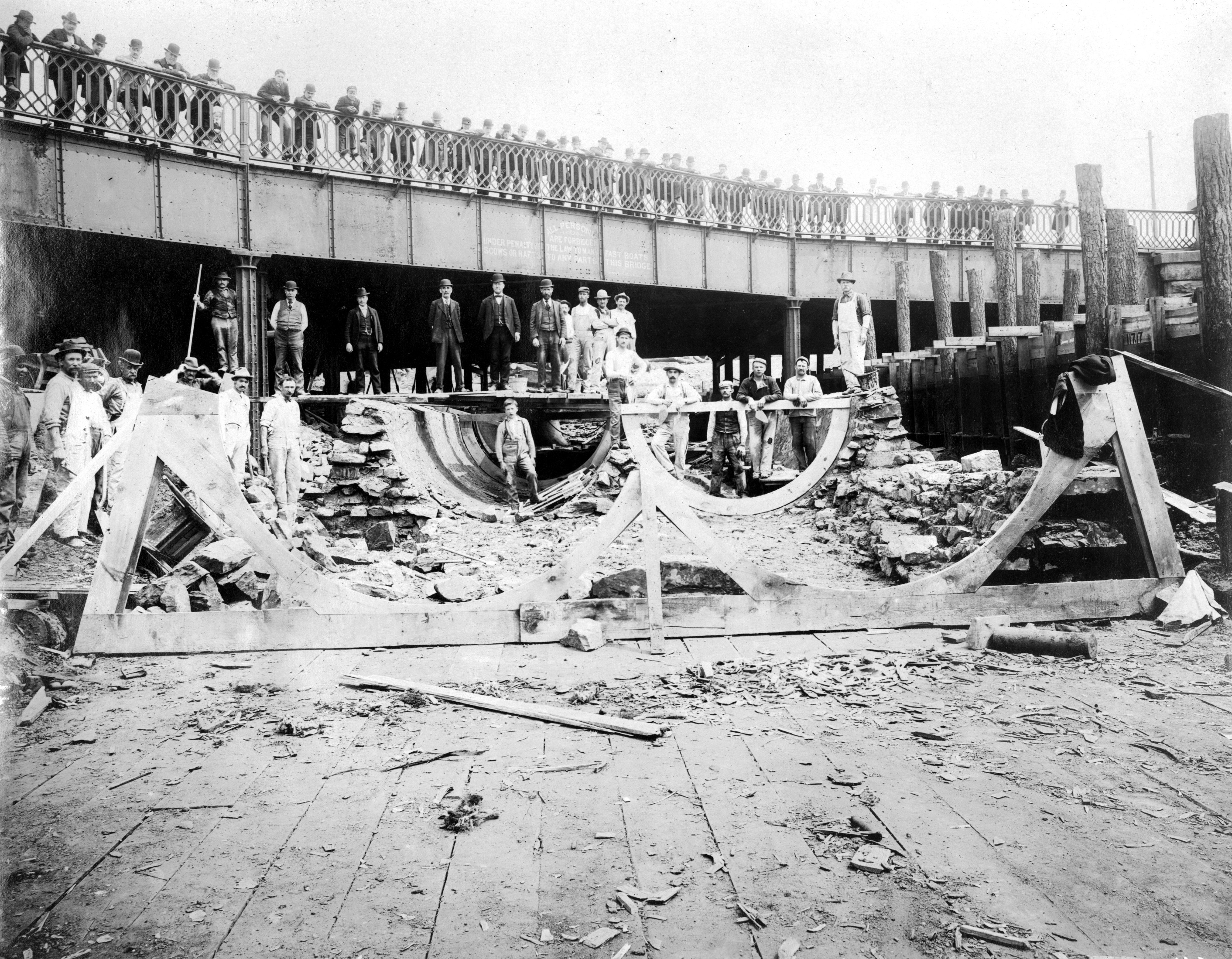 Men stand around the under construction Aramingo Sewer near Girard Ave., May 2, 1900