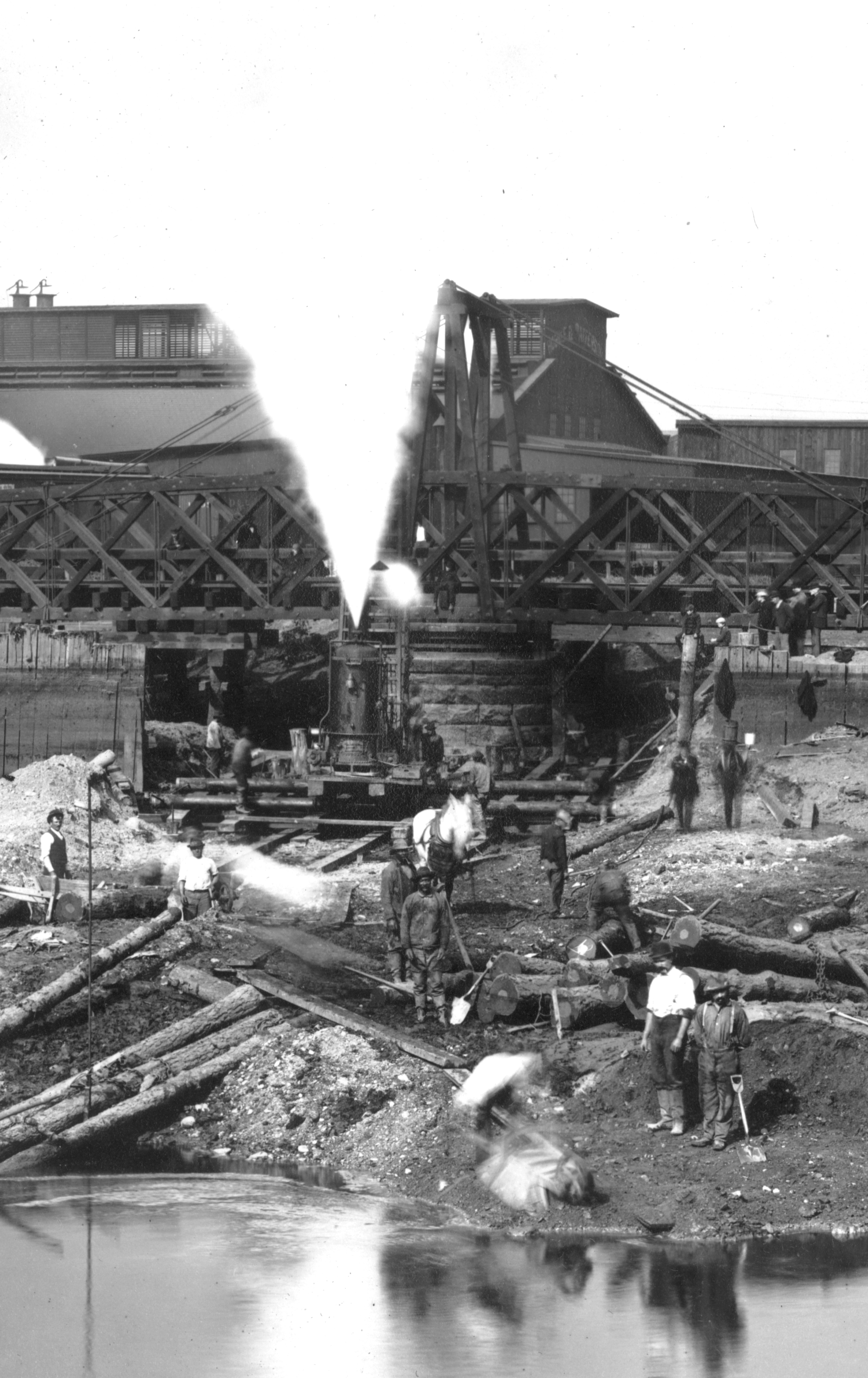 Detail from cofferdam phot - workers and a horse behind a water