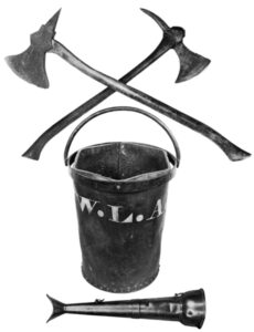 Fire axes and fire buckets were standard fire-fighting equipment in the 18th century. The buckets carried water; the axes were used to break into burning buildings. The speaking trumpet at the bottom was used to communicate with firefighters at the scene.