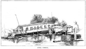 Black-and-white image of a covered dock slanting down to the water with a house in front of it