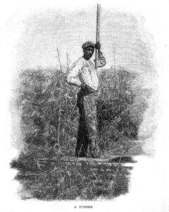 Black-and-white image of a man in a boat with a long pole