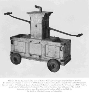 A hand-pumped fire engine made in Philadelphia in 1792. Water was stored in the copper lined wooden boxes, and two men (one pumping on each handle) forced the water up through the pipe on top, into a hose. (It can be assumed that a bucket brigade was used to keep the boxes filled.)